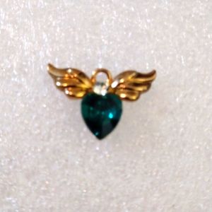 Avon NR faux gold diamond and heart shaped emerald lapel pin.